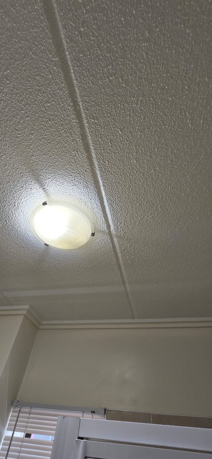 Clean bedroom ceiling after remediation